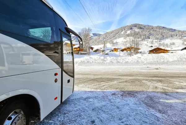 A transfer coach in a ski resort, taking skiers and snowboarders from the airport to their winter holiday. Airport transfers to ski resorts across europe.