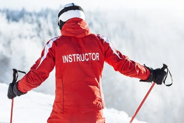 Ski Instructor on the slopes giving group or private ski lessons
